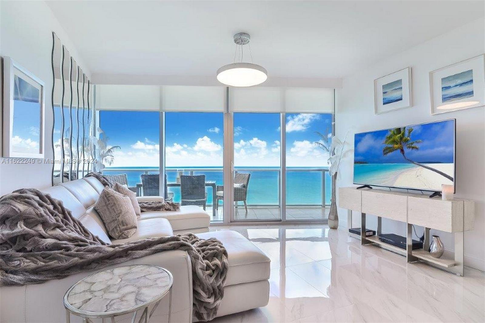Step into the splendor of Sunny Isles Beach in this 39th-floor gem. Boasting a private foyer entrance to a spacious 2-Bedroom + DEN layout, 3 full bathrooms, and ample closet space. Enjoy the stunning Atlantic Ocean views from your expansive terrace with direct East exposure. Luxurious amenities include a concierge, beach service, valet parking, fitness center and spa, café, kids' beach tent and play area, and beautiful sunrise & sunset pools. Across the street, explore shopping, dining, and retail options for a vibrant, convenient lifestyle. Experience beachfront luxury in an iconic 170th Street location. *Note: Delivered Unfurnished. Lighting
fixtures are not included. Available mid-August. Schedule your private showing today and elevate your living experience.