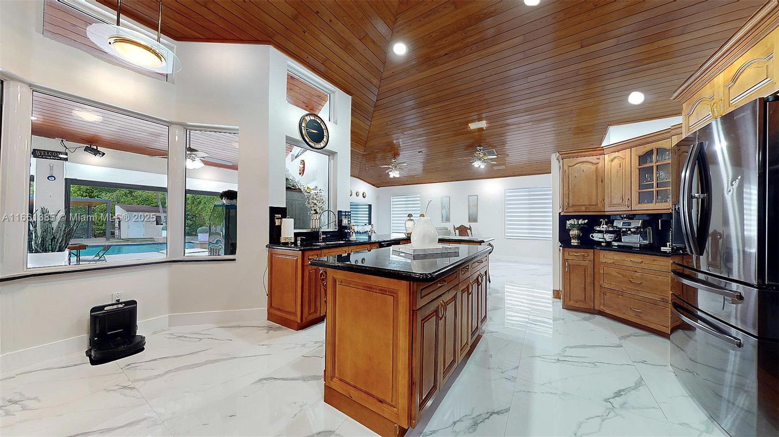 Would you like an Airbnb? Come see this stunning property. Upon entering the house, you are welcomed by stunning wood-vaulted ceilings. This luxurious home has a total area of 4,027 SF, over 1/4 acre of land and a spectacular pool area with 2 separate social areas. 5 beds & 4 baths. One of the bedrooms has a separate entrance. Impact windows & doors. The chef’s kitchen boasts granite countertops, wood cabinets, coffee bar, large island perfect for entertaining, and a combination microwave/convection wall oven. The luxurious primary suite features a walk-in double rain shower, whirlpool, separate vanities & him & her built-in closets. Summer kitchen with all the bells & whistles in your private backyard oasis. Steps away from the pool is an in-law quarter and separate office/storage area.