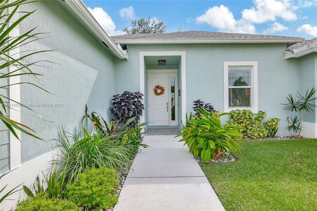 Photo of 418 SW Lakota Ave, Port Saint Lucie, FL 34953 (MLS # A11478501)