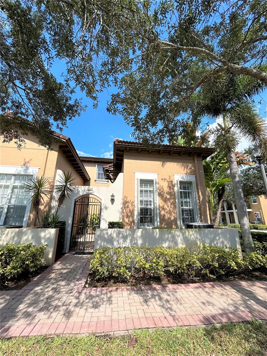 Beautiful corner Town house with 3-bedroom, 2bath located in the also nice and quiet gated community of Cobblestone, Pembroke Pines. This move-in ready home features granite countertops, stainless steel appliances, natural light. Cobblestone offers resort-style amenities including a pool, clubhouse, playground, and 24-hour security. Ideally located near top-rated schools, shopping, dining, parks, and with easy access to major highways. laminate flooring upstairs. The property offers two attached parking garage and a private driveway located behind the house. Do not wait too long this won't last...