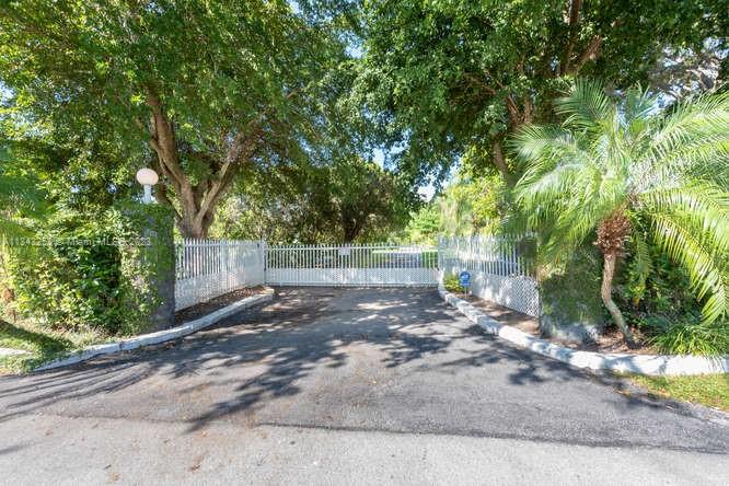 Welcome to a 4 bd/4ba home on a builders acre located in the very desirable area of SE Pinecrest. There is a community center, parks, farmers market, Pinecrest Gardens, Deering Estate CC with golf and more. This property offers a teriffic opportunity to own a very private piece of paradise in a beautiful setting with a peaceful Koi pond. The home is situated on the highest elevation in Pinecrest and in a no flood zone. Inside, you'll find extra spacious rooms, a living and dinning area with plenty of natural light opening to a large pool and patio great for entertaining family and friends. Perfect to remodel or build a second floor, newbuild or investment property. Top rated schools and close to shopping, dining, and entertainment. Come take a look and make this your home today!