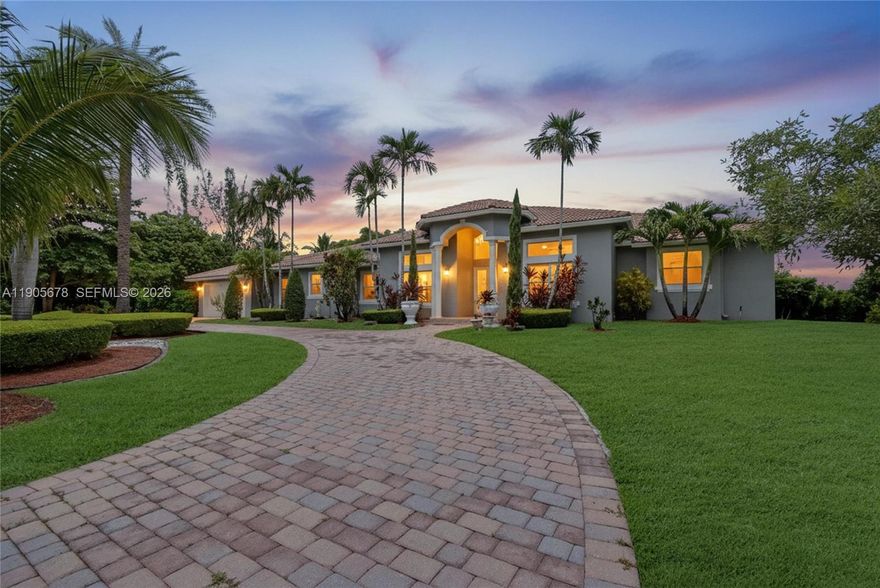 Welcome to this exceptional one-story home in Southwest Ranches, set on a spacious builder’s acre lot. With no HOA restrictions, this property offers excellent flexibility for short or long-term rentals and is currently operating as a successful Airbnb. This 4 bed, 4.5 bath home features soaring ceilings, updated bathrooms, porcelain and tile floors, and a functional split floor plan. The fenced backyard offers 36,207sqft qith canal views with dog run, an 8ft waterfall pool with a new pump, jacuzzi & 1,100 SF covered patio with an outdoor kitchen and fruit trees. Additional features include a 2-car A/C garage, tankless water heater and A/C (2018), and a circular driveway that fits 8–10 cars. Ideal as an investment, vacation home, or the opportunity to redesign and create your dream home