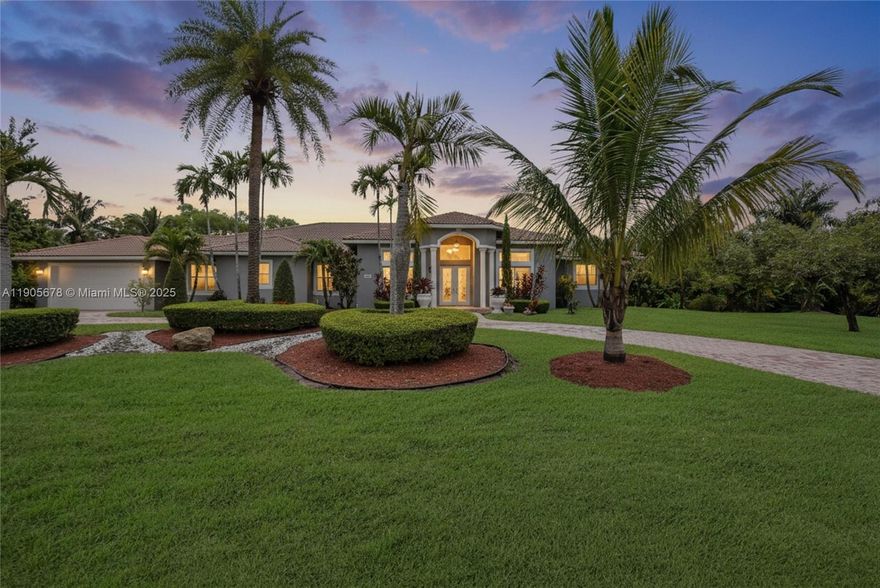 Welcome to this exceptional one-story home in Southwest Ranches, set on a spacious builder’s acre lot. With no HOA restrictions, this property offers excellent flexibility for short or long-term rentals and is currently operating as a successful Airbnb. This 4 bed, 4.5 bath home features soaring ceilings, updated bathrooms, porcelain and tile floors, and a functional split floor plan. The fenced backyard offers 36,207sqft qith canal views with dog run, an 8ft waterfall pool with a new pump, jacuzzi & 1,100 SF covered patio with an outdoor kitchen and fruit trees. Additional features include a 2-car A/C garage, tankless water heater and A/C (2018), and a circular driveway that fits 8–10 cars. Ideal as an investment, vacation home, or the opportunity to redesign and create your dream home