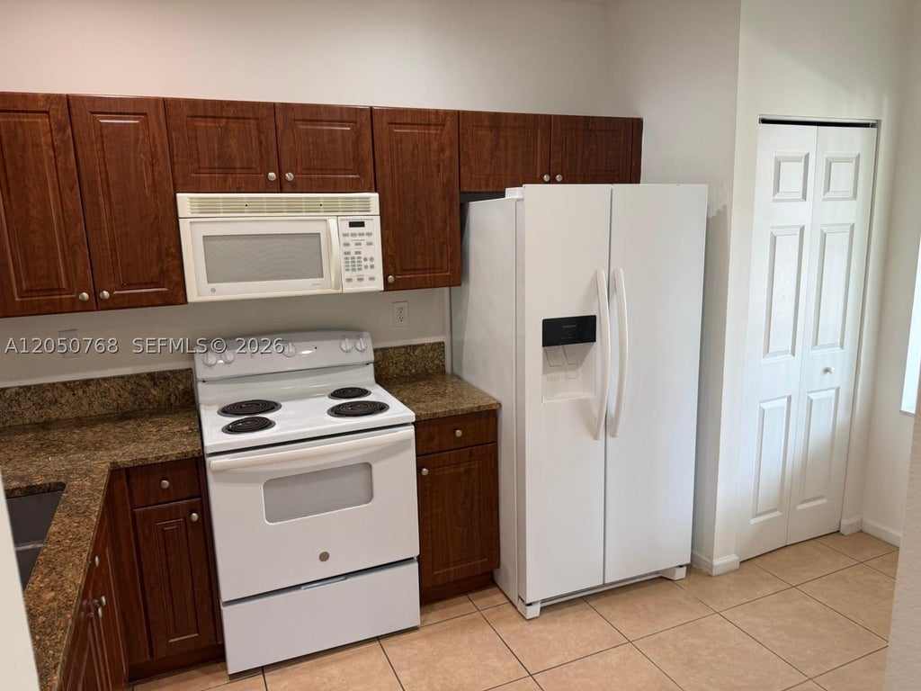 Photo of 8250 SW 27th St #104, Miramar, FL 33025 (MLS # A12050768)