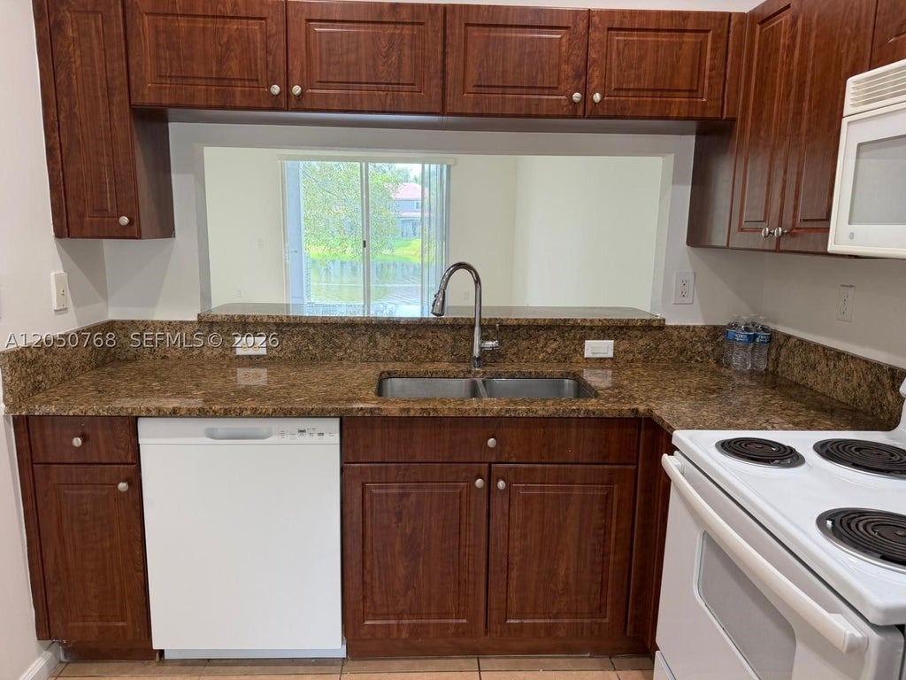 Photo of 8250 SW 27th St #104, Miramar, FL 33025 (MLS # A12050768)