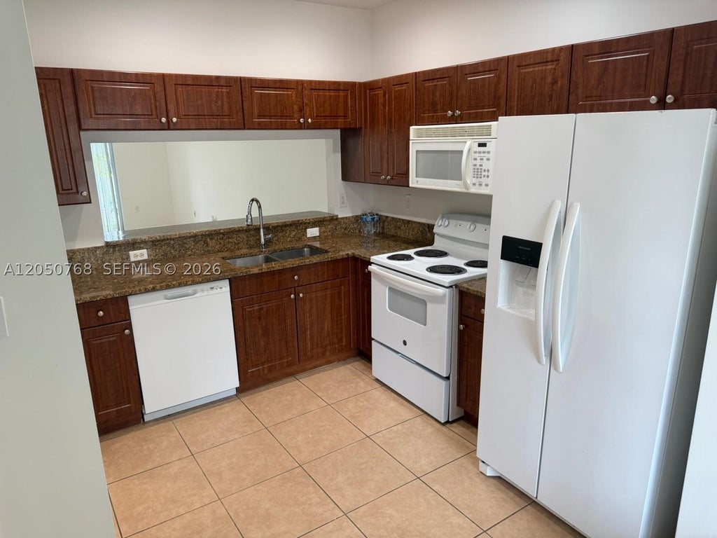 Photo of 8250 SW 27th St #104, Miramar, FL 33025 (MLS # A12050768)