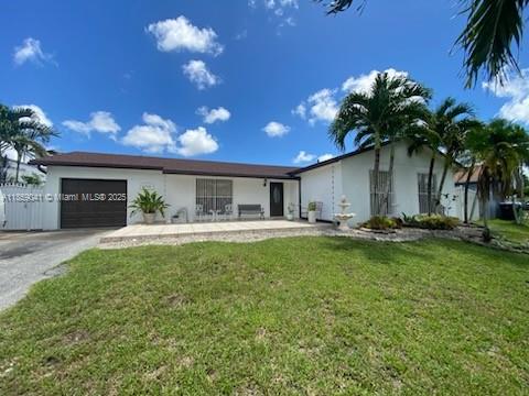 This 4 bedroom, 2 bath home is located in a peaceful neighborhood and offers a spacious and open layout with a combined living and dining area, perfect for both family living and entertaining. The home has been completely renovated, with a new roof replaced in 2022 and still under warranty, screened terrace and backyard with fruit trees. The backyard is adjacent to a water canal with plenty of fish, the perfect spot for fishing from your own backyard!!! Conveniently located near schools, shopping centers and local amenities, and easy access to highways, this property is ready to meet your needs for convenience, comfort and potential . Don't miss this great opportunity to own a versatile, well located home!!!