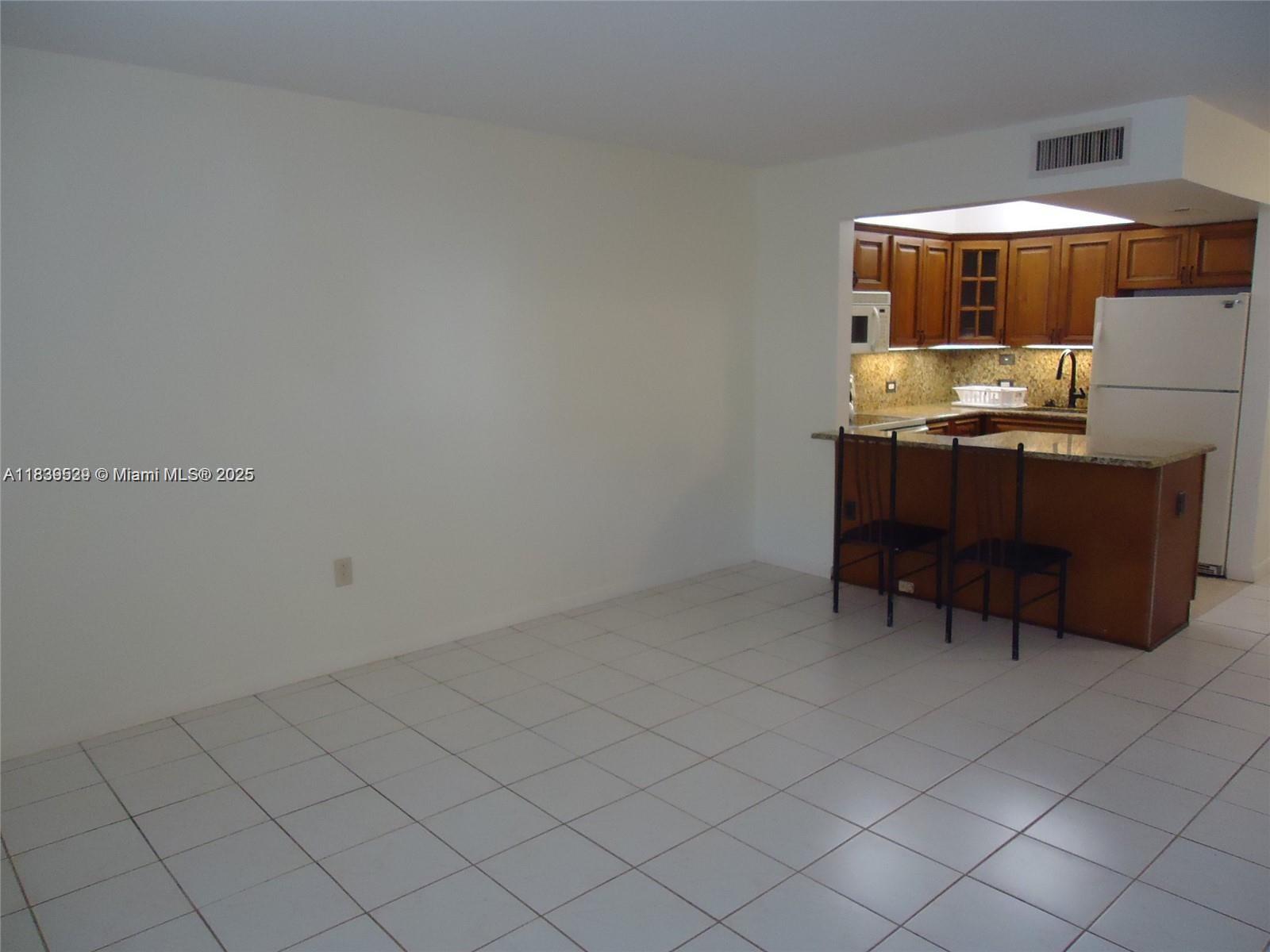 Spacious 1-bedroom condo in North Bay Village! This ground-floor unit features an open layout, tile floors throughout, and abundant natural light. Enjoy a large bedroom with ample closet space and a functional kitchen. Can be rented right away! The building offers a pool, laundry facilities, and parking. Prime location just minutes to Miami Beach, Midtown, and major highways. Walk to restaurants, parks, and the bay!
