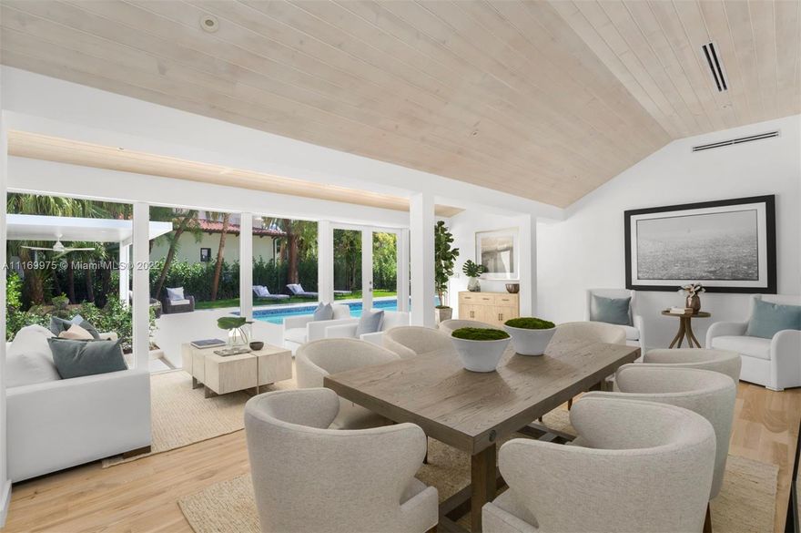 Enjoy a life of coastal elegance in this Sunset Island II home, fully renovated in 2022. Turnkey 4BR/4.5BA on a coveted corner lot across from a serene, palm tree-lined park. Soaring ceilings & views of the lush backyard with oversized sparkling pool greet you as you step inside. An abundance of natural light pours in from glass walls of hurricane impact windows & doors, illuminating the great room w/ marble clad fireplace & exposed wood beams throughout open living & dining room. Custom designed eat-in kitchen w/ marble countertops, Miele & Subzero appliances. Primary suite boasts spa like bathroom w/ large walk-in closet, dual headed shower, double sinks & vanity area & French Doors leading to private pool & backyard.