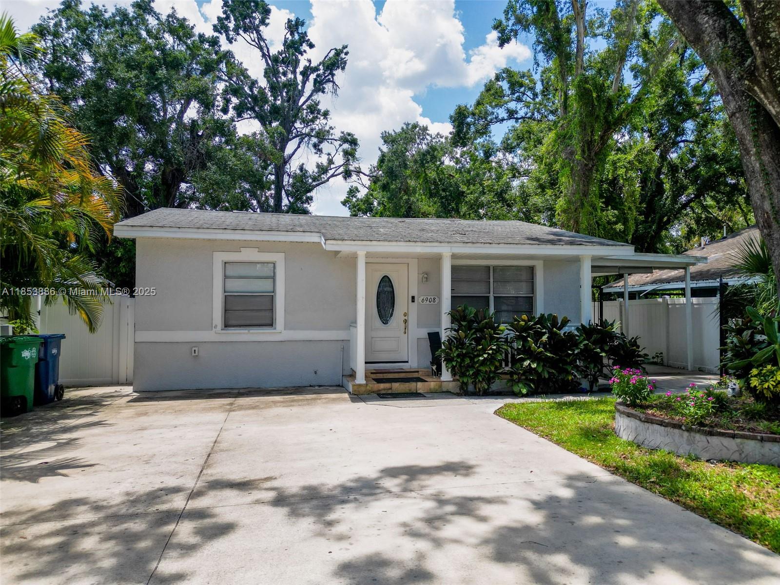 Nestled in the heart of Tampa, this stunning ranch-style home offers the perfect blend of Florida charm & comfort. This home features 3 beds and 2.5 baths, situated on a generously proportioned lot. The spacious master bedroom w/walk-in closet & an en-suite bathroom w/double vanity & a shower. HVAC, water heater, & fence were replaced in 2023. The enclosed porch & patio provide a serene space for outdoor dining. Potential expansion, to create additional living space, w/convenient 1/2 bath, sink, ensuring guests don't need to enter the main house. The fenced-in backyard is a private retreat ideal for pursuing outdoor hobbies or simply enjoying some sunshine. Extra parking space for RVs, Boats, or Jet skis. Conveniently located 1 minute from the Tampa Zoo & 11 minutes from Downtown Tampa.