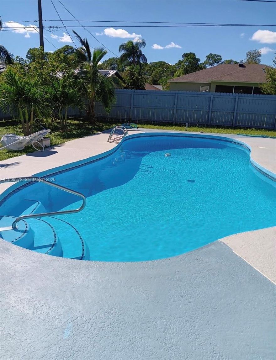 Beautiful  4-bedroom, 2-bath home with a private pool located in the desirable Port Malabar area of Palm Bay. This move-in ready property features porcelain tile and laminate flooring throughout—no carpet—and an updated kitchen with modern cabinetry and granite countertops. Enjoy a spacious layout with a 2-car garage and a large backyard perfect for entertaining. The property offers plenty of space to park a boat or RV, with no HOA restrictions. Relax in your private pool and enjoy Florida living at its best. Conveniently located near shopping, dining, major highways, and just a short drive to the Space Coast beaches. A must-see!