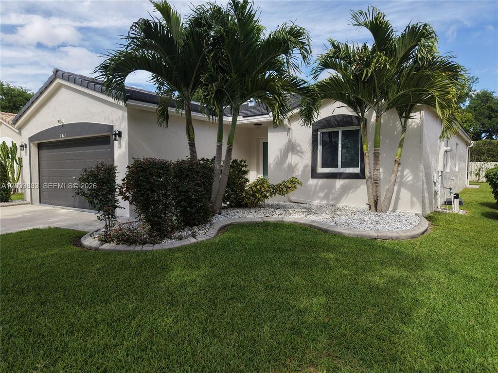 Photo of 2411 SW 103rd Way, Miramar, FL 33025 (MLS # A12003883)