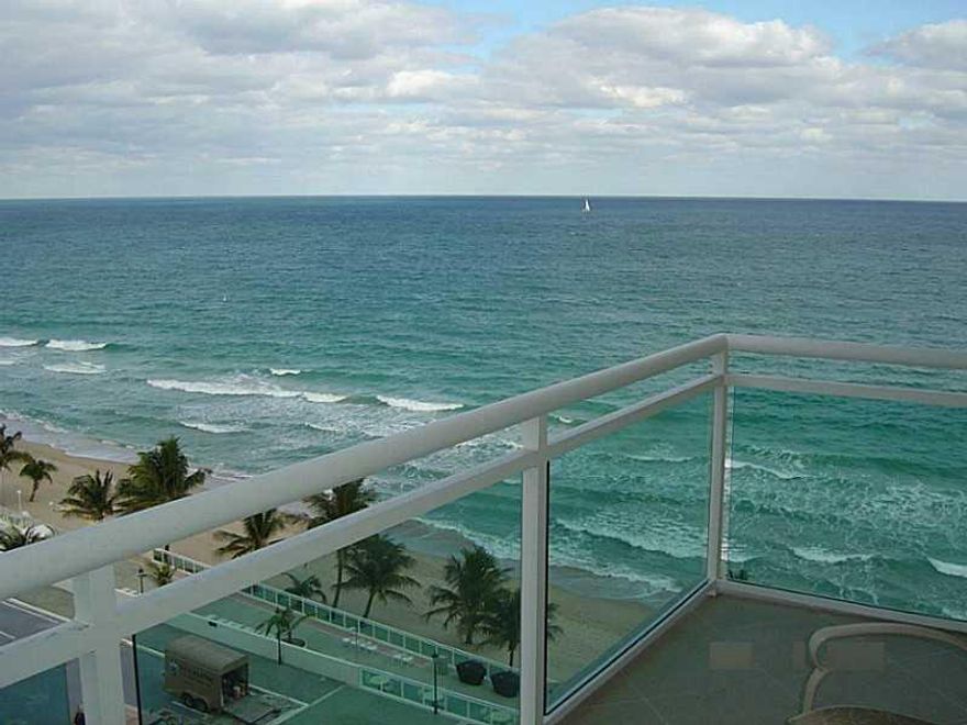 Beach view from master bedroom and beach and city views from glass balcony. Flexible floor plan and impact windows. Tile floor, and washer and dryer in the unit. Assigned garage covered parking included.