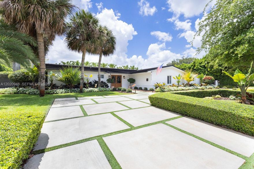 Welcome to this spectacular, fully modernized 4-bedroom, 3-bathroom turnkey estate located in the highly coveted Continental Park area of Kendall/Pinecrest border. Situated on an expansive 15,300 sq ft corner lot (Flood Zone X), this concrete block home seamlessly blends timeless mid-century structure with ultra-premium luxury upgrades. Inside, discover a bright, open split-bedroom floor plan lined with pristine wood-like porcelain tile throughout. The home features a full Control 4 Home Automation system, including a Lutron Lighting Control system complete with indoor/outdoor audio, intelligent security cameras, and sleek motorized shades (solar & blackouts) in every room. Alkaline water filtration system for the entire home.The gourmet kitchen and formal dining spaces flow effortlessly into an outdoor entertainer’s paradise. Step out to a massive private backyard featuring a large sparkling pool, premium stone decking, a custom outdoor bar, and an oversized pergola—perfect for alfresco dining. Structurally, the property offers total peace of mind with a newer roof (under 10 years old), full impact windows and doors, and a elegant circular driveway. Located in a quiet, high-equity neighborhood with top-rated schools (Kenwood K-8) and easy access to Baptist Hospital, upscale shopping, and major highways. This smart-home sanctuary offers the ultimate South Florida lifestyle. Easy to show—schedule your private tour today!