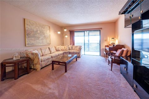 Photo of 4970 E Sabal Palm Blvd #405, Tamarac, FL 33319 (MLS # A11936032)