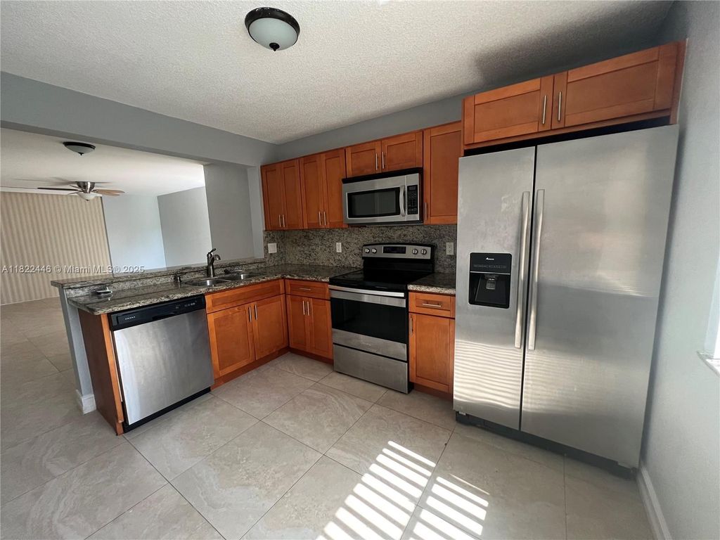 Photo of 5801 Riverside Dr #201B3, Coral Springs, FL 33067 (MLS # A11822446)