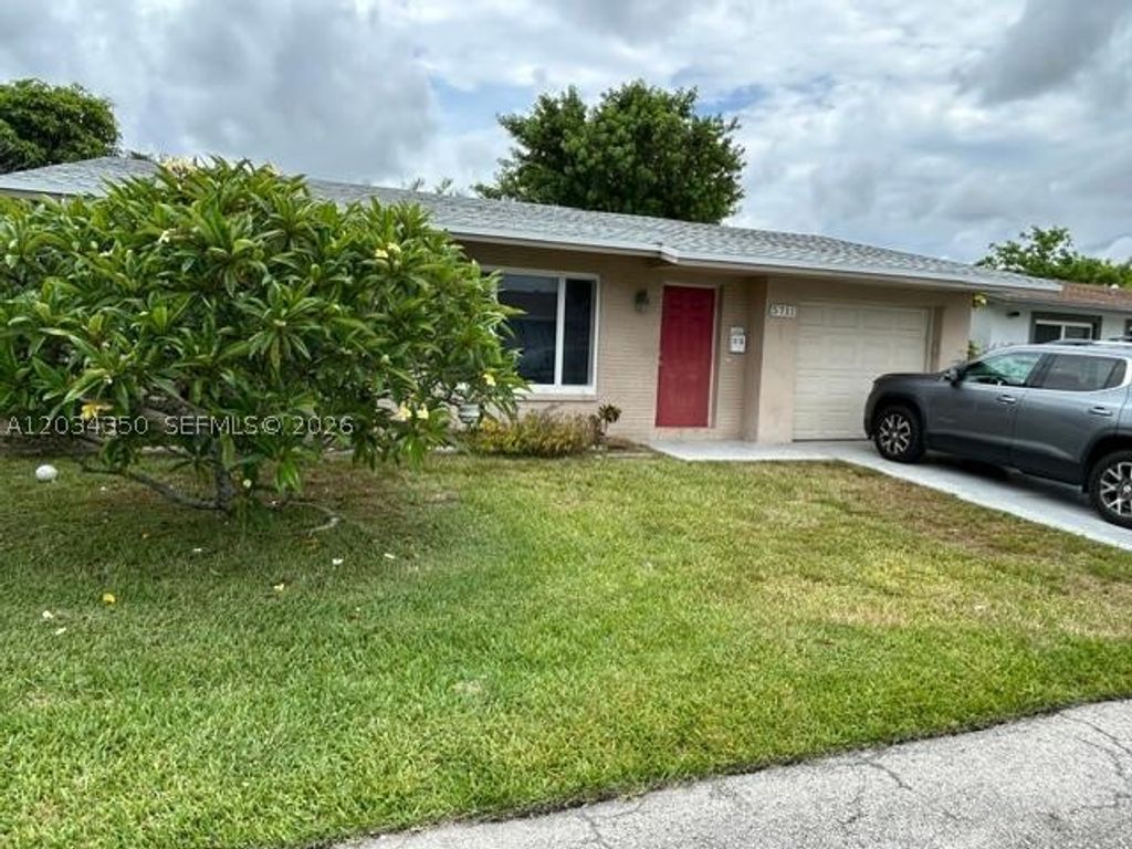 Photo of 5711 NW 48th Ter, Tamarac, FL 33319 (MLS # A12034350)