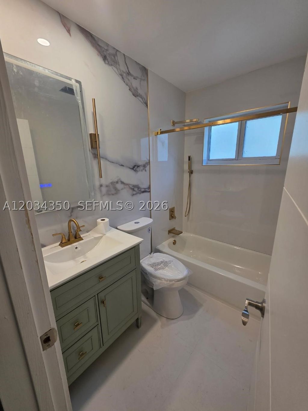 Photo of 5711 NW 48th Ter, Tamarac, FL 33319 (MLS # A12034350)