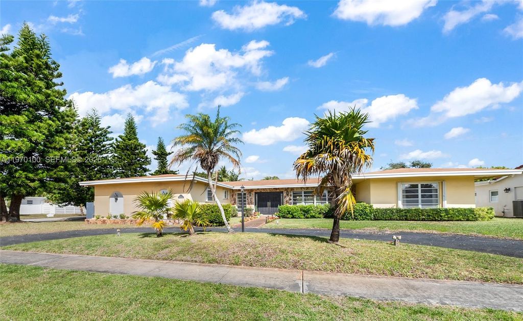 Photo of 4931 Madison St, Hollywood, FL 33021 (MLS # A11970100)