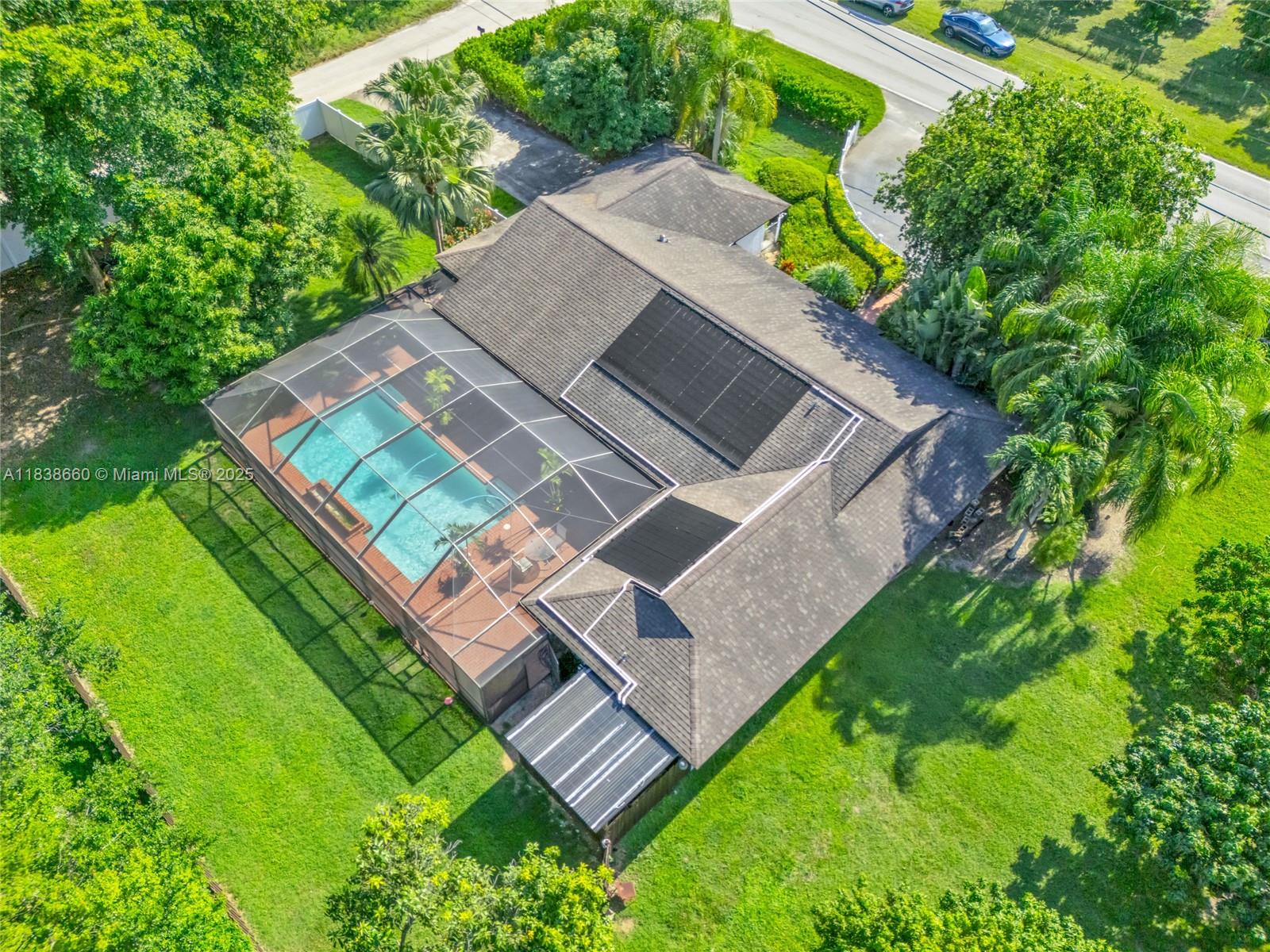Welcome to your private Redlands retreat within a builder’s acre with no HOA. This 4-bed, 2-bath home (one room used as a large walk-in closet, easily restorable) sits on a corner lot with a screened solar heated pool, cabana bath, 2-car side-entry garage, white-picket porch butterfly garden. The primary suite offers dual closets, double sinks, a Jacuzzi tub, and French doors to the pool. Vaulted cedar ceilings and a gourmet kitchen with oversized gravimetry adds charm. All windows are high impact rated. A full reverse osmosis system filters well water for the home, enjoy a flourishing ½-acre fruit tree grove with its own irrigation. A second irrigation system services the main grounds. This is more than just a home – it’s a private estate lifestyle in the heart of the Redlands.