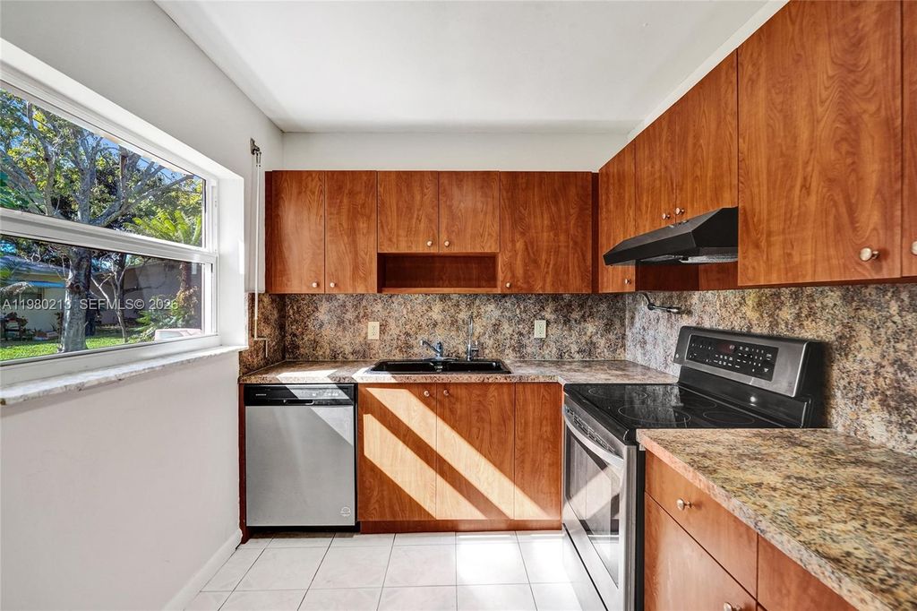 Photo of 2621 SW Natura Ave, Deerfield Beach, FL 33441 (MLS # A11980213)