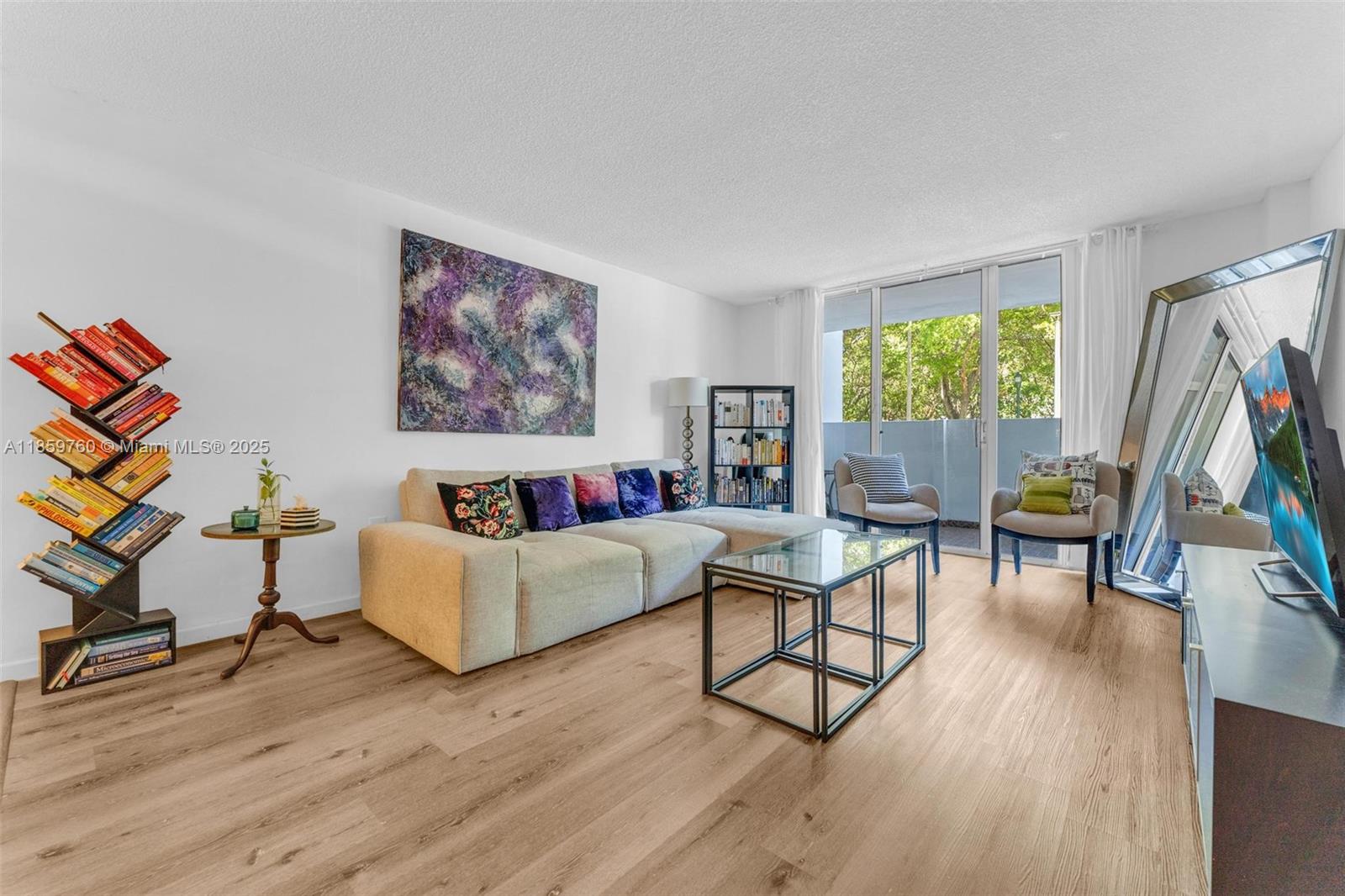 Walk from your car straight into your home—no elevators, no hassle. First-floor 2 bed / 2 bath condo at Commodore Plaza with covered parking space located just steps from the unit. 1,058 sq ft under AC with a split-bedroom layout and spacious living areas. Community amenities include 24-hour security, 2 pools, tennis courts, gym, library, and marina access. Prime Aventura location near top-rated schools, Aventura Mall, beaches, dining, and houses of worship.