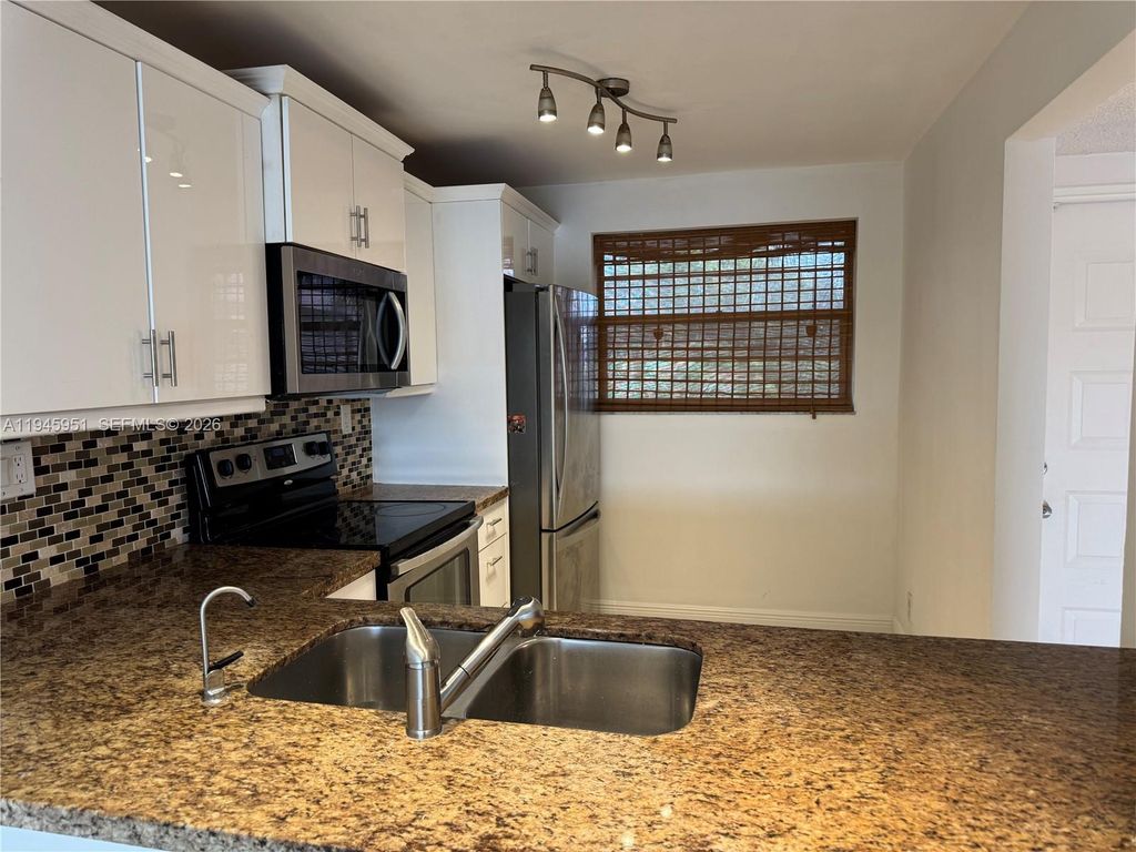 Photo of 1831 Sabal Palm Dr #403, Davie, FL 33324 (MLS # A11945951)