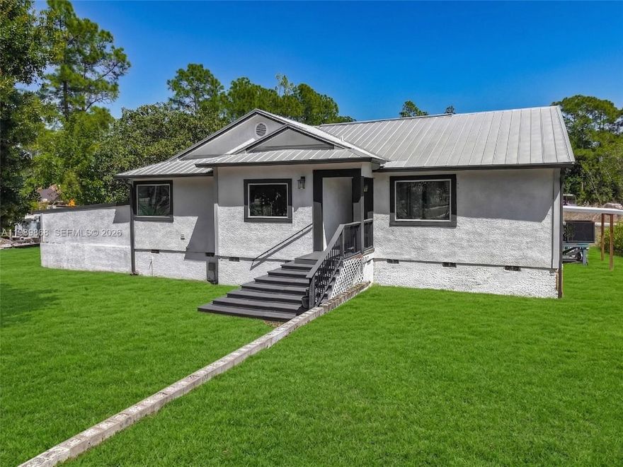 Situated on an expansive 2.72-acre homesite, this beautifully remodeled single-family residence offers privacy, flexibility, and exceptional upgrades throughout. Offering just under 1,500 square feet of living space, the home features stunning six-foot plank flooring and a bright, open layout designed for modern living. The fully renovated kitchen is a true centerpiece, showcasing quartz countertops, brand-new cabinetry, a stylish backsplash, and stainless steel appliances, all complemented by upgraded lighting and fixtures. Both bathrooms have been completely updated with a refined, spa-like feel, including a beautiful soaking tub in the primary bath. The home has been thoughtfully improved from top to bottom, creating a clean, cohesive, move-in-ready interior. Additional upgrades include a newer metal roof and full impact windows and doors, providing long-term durability, efficiency, and peace of mind. Step outside to your private outdoor retreat featuring a pool and expansive grounds with endless potential. Whether you’re looking for space to expand, store boats or RVs, or simply enjoy wide-open surroundings, this property delivers the freedom and versatility that’s increasingly hard to find. A rare opportunity to own a fully upgraded home on acreage with room to live, grow, and enjoy.