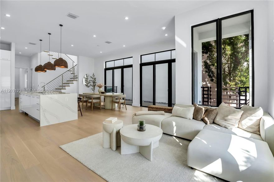 Experience modern luxury living in the heart of Downtown Doral in this 2023 Cadiz model, offering 4 bedrooms and 4 baths with a full bedroom and bathroom on the first floor plus a one car garage. The open floor plan features soaring volume ceilings, full impact windows, and a gourmet designer kitchen with JennAir appliances, quartz countertops, and custom cabinetry, creating an ideal space for entertaining. Enjoy beautifully landscaped paseos that lead you to parks, restaurants, shops, and award winning schools, all just steps from your front door. Residents of Canarias have exclusive access to a resort style clubhouse with a fitness center, pool, spa, and curated lifestyle amenities. Live the ultimate urban experience in a private oasis where walkability, luxury, and convenience come together in one of South Florida’s most desirable communities.