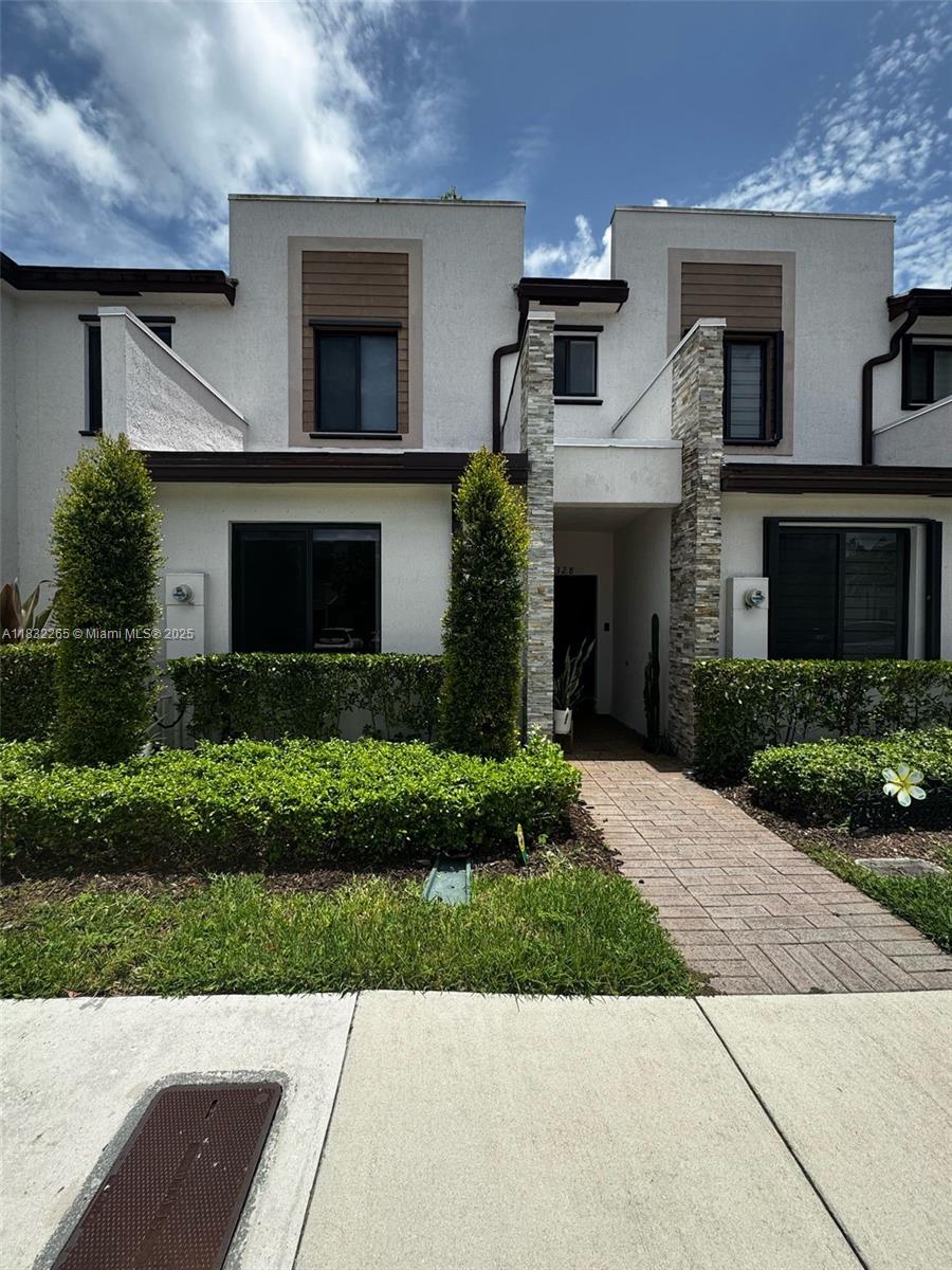 Welcome to this beautifully maintained 3-bedroom, 3-bathroom townhouse in the sought-after Via Ventura community. Built in 2019, this spacious 1,320 sq ft home offers modern finishes, a smart layout with one full bedroom and bathroom on the ground floor, and a private fenced patio perfect for outdoor relaxation. The open-concept living area features tile flooring, while the upstairs bedrooms offer plush carpeting. Enjoy the convenience of two or more parking spaces and ample street parking. Gated community with secured entry for peace of mind. Ideally located near major highways, Aventura Mall, top-rated schools, and beaches. No HOA approval needed. Low HOA fees and no rental restrictions—perfect for end users or investors! Move-in ready and easy to show—schedule your tour today!