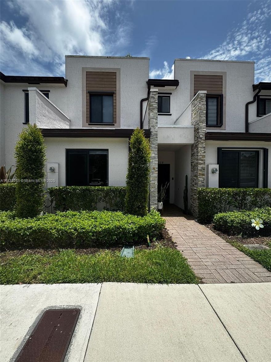 Welcome to this beautifully maintained 3-bedroom, 3-bathroom townhouse in the sought-after Via Ventura community. Built in 2019, this spacious 1,320 sq ft home offers modern finishes, a smart layout with one full bedroom and bathroom on the ground floor, and a private fenced patio perfect for outdoor relaxation. The open-concept living area features tile flooring, while the upstairs bedrooms offer plush carpeting. Enjoy the convenience of two or more parking spaces and ample street parking. Gated community with secured entry for peace of mind. Ideally located near major highways, Aventura Mall, top-rated schools, and beaches. No HOA approval needed. Low HOA fees and no rental restrictions—perfect for end users or investors! Move-in ready and easy to show—schedule your tour today!