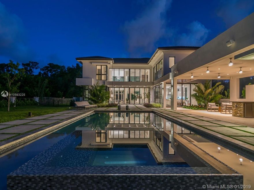 Spectacular Contemporary masterpiece completed in 2017. Corner lot completely walled in & gated for privacy in North Pinecrest. House was meticulously designed w/ superior finishes including soaring ceilings & panoramic walls of glass integrating indoor & outdoor spaces. The foyer entrance will lead you towards the magnificent double height living & dining room overlooking the garden & pool area. Property also features Mia Cucina Italian designed vanities & kitchen cabinetry w/ white Quartz countertops, hardwood & marble floors throughout, electric shades, Lutron & surround sound systems & elevator. Enjoy resort style outdoor living w/ fully equipped kitchen, heated pool, covered patio, separate gym area w/ full cabana bath surrounded by beautiful landscaping. Perfect for entertainment.