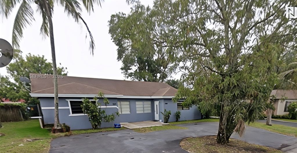 Photo of 7318-7320 NW 76th Dr, Tamarac, FL 33321 (MLS # A12040448)