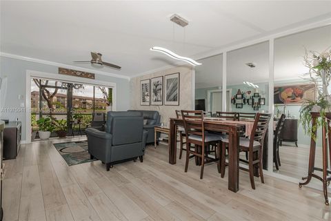 Photo of 13705 SW 12th St #104B, Pembroke Pines, FL 33027 (MLS # A11975041)