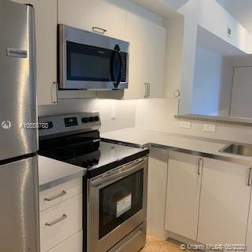 LOCATION! In Miramar. NEW Kitchen, NEW appliances, NEW vanities, lamps and WC in each bath, recently painted, NEW Impact Door at the balcony, NEW Blinds. The unit has high ceiling, beautiful natural light. Excellent location. Condo with amazing amenities. Walking distance from Miramar Town Center. The condo has open parking lot.