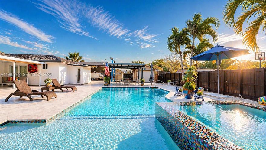 Spectacular 4 bedroom, 3 bath pool home in a very well oriented neighborhood. Recently fully renovated, with an elegant formal dining room and living room, resort style saltwater & heated swimming pool salted. Situated on a 12,000Sq ft Lot with a new outdoor gas kitchen, master bedroom suite with direct access to the pool/patio area. A/C unit two years old, new tankless and new stainless-steel appliances Shed for tools and pool stuff and cameras included. Huge parking to have truck or RV. Impact windows throughout the home. It won't last!!!!!!.