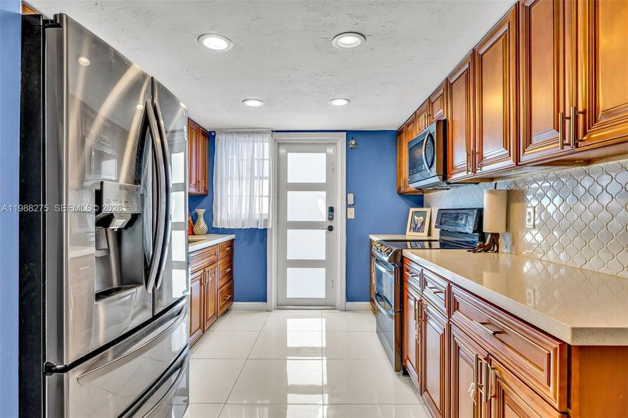 Light and bright, spacious garden apartment in a prime location. This tastefully remodeled 2 bedroom 2 bathroom first floor corner unit features an updated kitchen with stainless steel appliances that opens to a spacious living area, perfect for everyday living and entertaining. Both bathrooms have been remodeled, and the enclosed sunroom adds additional living space. Tile floors run throughout the unit.

Partial impact windows offer added peace of mind, with the exception of the sunroom. The building’s wastewater plumbing connection to the city was replaced in 2022. Maintenance includes water and access to laundry facilities. Security cameras are installed on the premises, and your assigned parking space is just steps from your front door.

Ideally located close to Downtown Hollywood, Hollywood Beach, restaurants, shopping, schools, public transportation, and major highways for easy commuting.

All buyers welcome including first time homebuyers, second home seekers, and investors. Excellent investment opportunity with immediate rental allowed, also perfect for seasonal living.