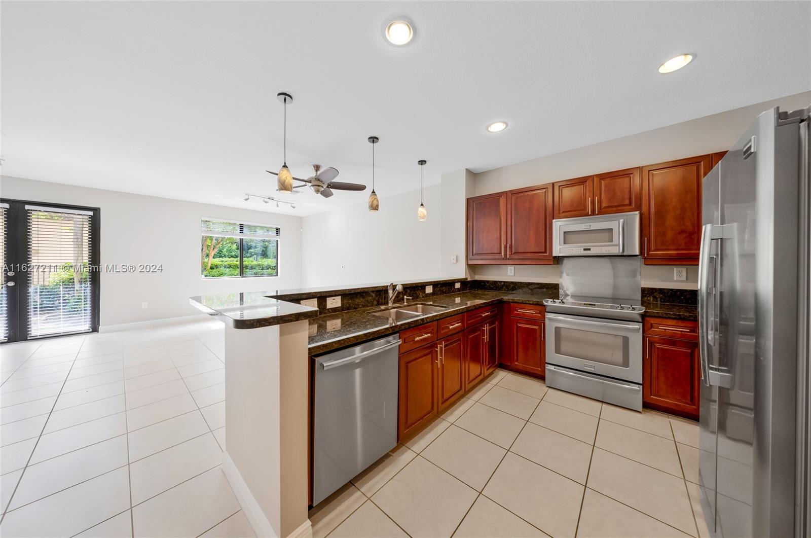 This refreshed townhouse in Edgewood Landings offers one of the largest floorplans in the complex. With 3 bedrooms, 2.5 baths, a new roof, impact windows, and vaulted ceilings, it's designed for ultimate comfort. The open-concept living areas include a gourmet kitchen with granite countertops and stainless steel appliances. Upstairs, enjoy the luxurious master suite with a jetted tub and walk-in closet, plus elegant wood floors. Highlights include 18x18 tiles, raised ceilings, ample storage, a 1 car garage, and an oversized patio perfect for entertaining. Residents have access to a community pool and Edgewood Passive Park. Ideally located just minutes from the airport, Las Olas Blvd and the beach. Don’t miss this rare opportunity to own a slice of paradise.