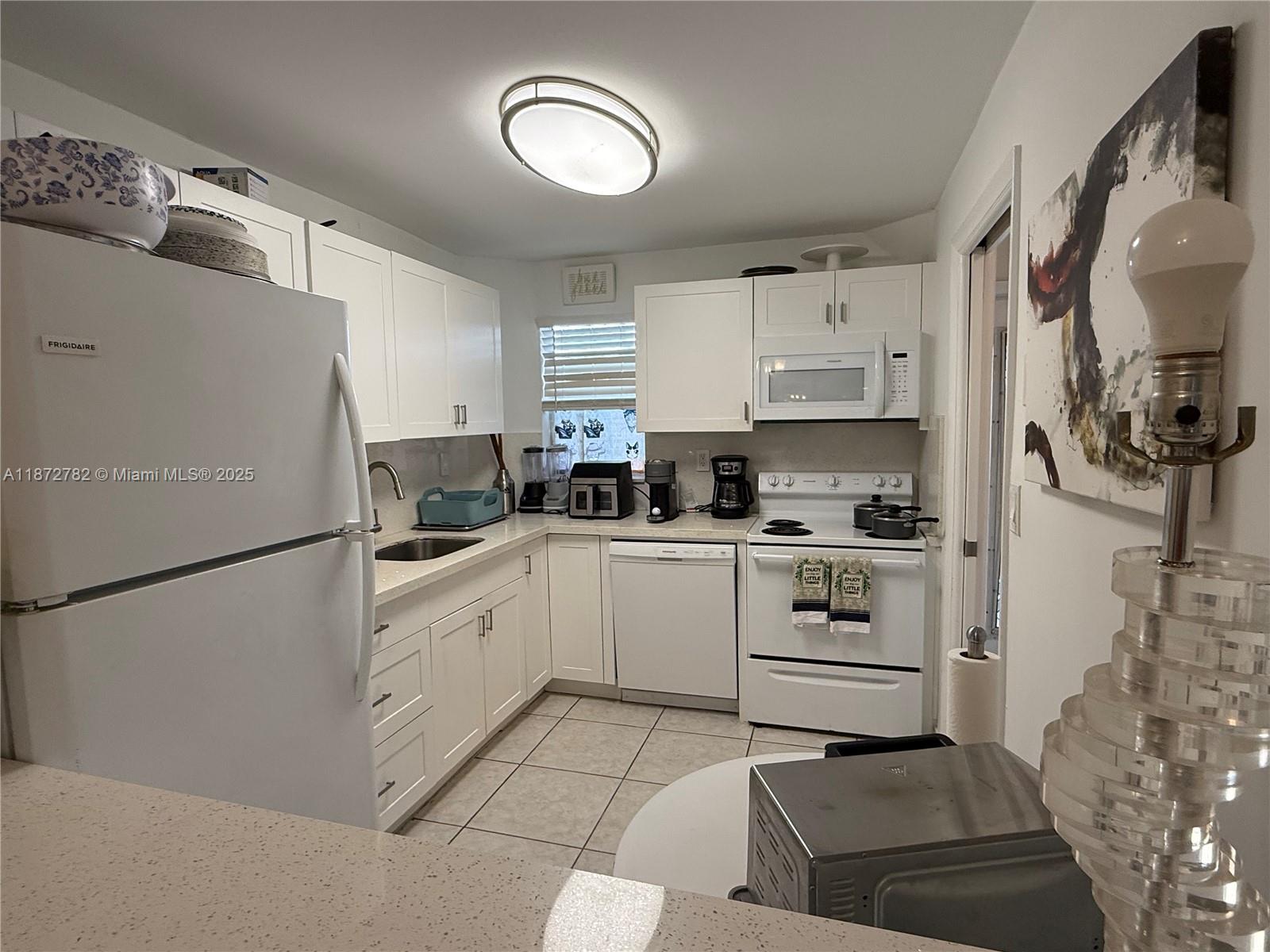 55+ active gated community. Ready to move in, spacious 1br/1ba/1 half bath unit, with balcony with a garden view. Kitchen renovated. Must see. Condo offers basic cable TV, landscaping, gated security, water, Clubhouse, Billiard Room, Courtesy Bus, Exercise Room, Heated Pool, BBQ/Picnic Area, Library, Sauna, Shuffleboard, Tennis, Pickle Ball, Vehicle Wash Area, Electric Car Charging Station and Free PGA and Par 3 golf courses (cart fees may apply). Great location, close to shopping, dining & highways. 15 min. to the beach. Lovely and charming place to live. Unit available and ready to move in. Notice that HOA requires 700 credit score, $73,360 Annual Income (each of 2 years) OR net worth of $250,000+, refundable deposit of $500 per car may apply.