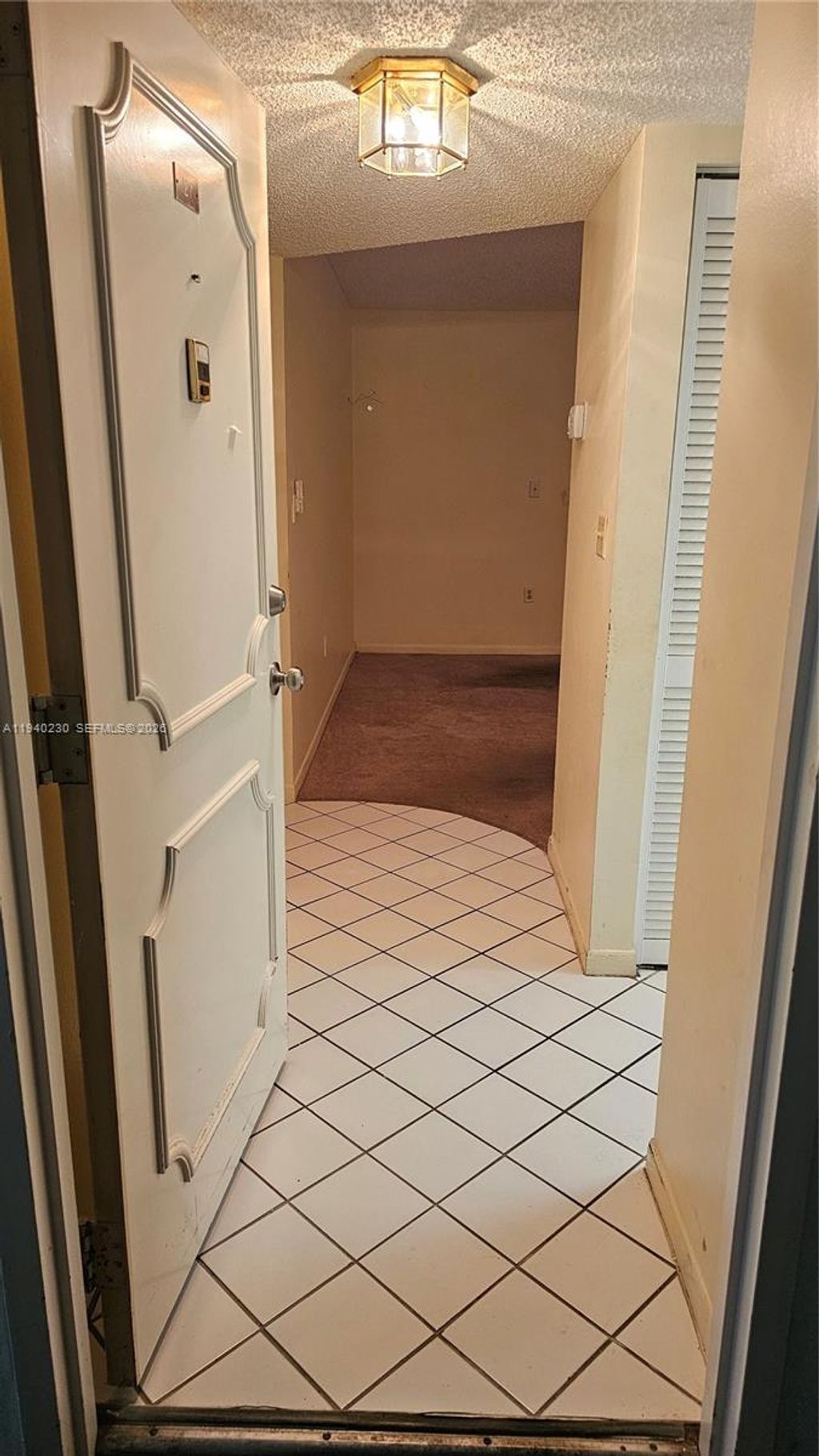 Photo of 4980 E Sabal Palm Blvd #127, Tamarac, FL 33319 (MLS # A11940230)