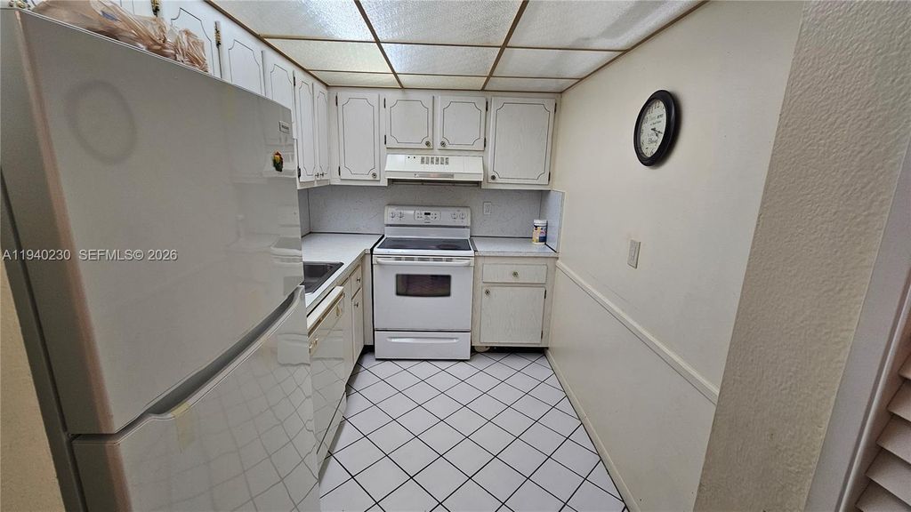 Photo of 4980 E Sabal Palm Blvd #127, Tamarac, FL 33319 (MLS # A11940230)