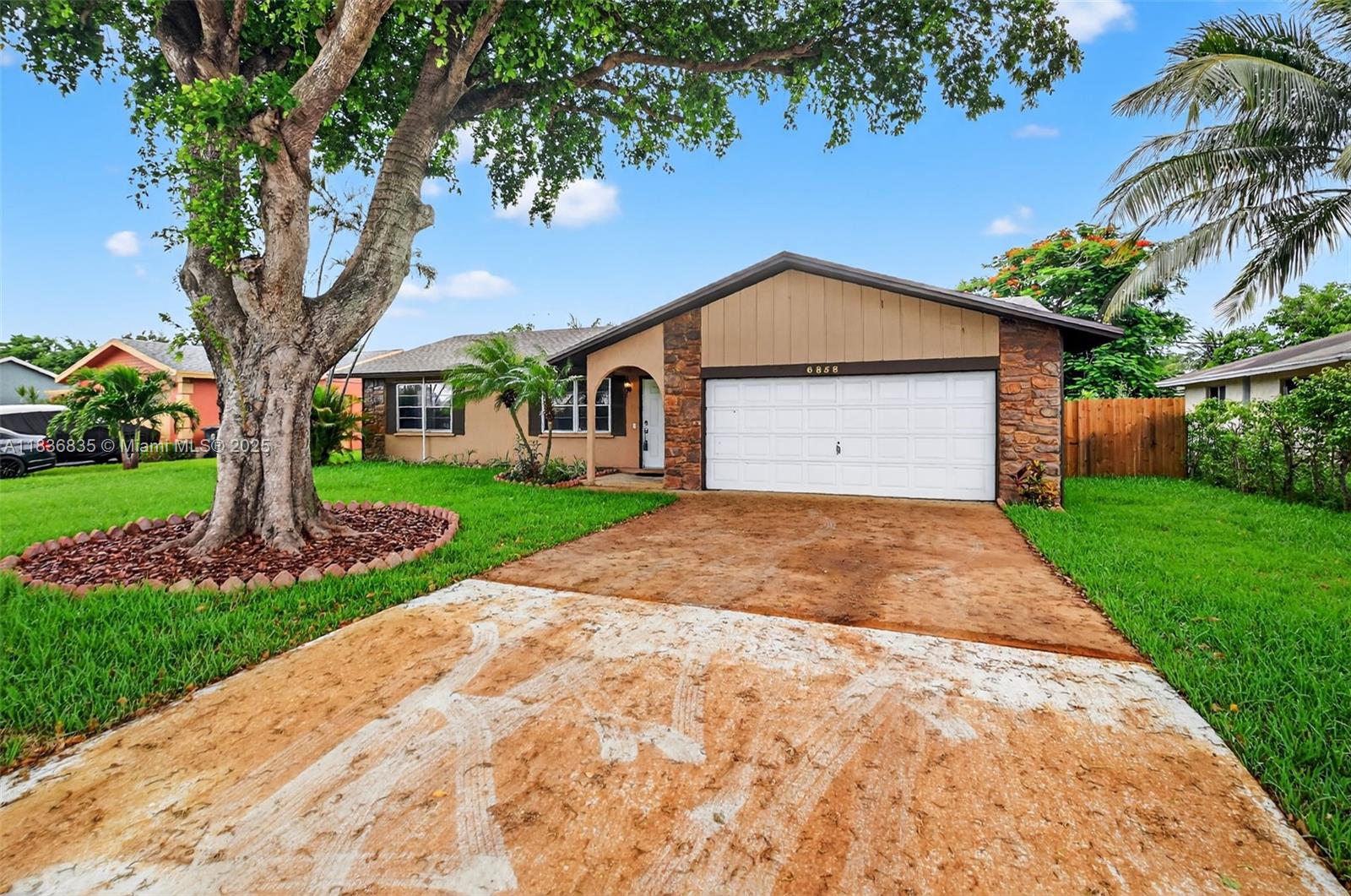 YOUR WAIT IS OVER..... Immaculately Maintained 3 Bedroom, 2 Bath, 2 Car Garage Home with an Enormous (23'x11.5') Enclosed Florida Room. Features an Inviting Floor Plan, Open Kitchen w/Serving Bar, Spacious Master Suite, Large Walk-in Closet, Generous Guest Rooms, Neutral Tile and Laminate Wood Flooring Throughout, Oversized Florida Room, Custom Pavered Paito and Wooden Deck, Fenced Grounds and a Slew of Recent Upgrades Including: 2023 SINGLE ROOF, 2025 FLAT ROOF, 2021 A/C, 2017 W/H, 2023 Exterior WOOD SIDING, 2025 WELL PUMP & IRRIGATION, 2021 ELECTRICAL PANEL, and 2025 FENCE. Centrally Located and Convenient to World Class, Shopping, Dining, Entertainment, Beaches, Travel, Schools and more.... HURRY THIS HOME WILL SELL FAST!!!
