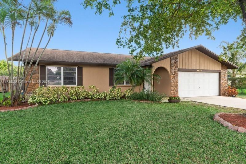 YOUR WAIT IS OVER..... Immaculately Maintained 3 Bedroom, 2 Bath, 2 Car Garage Home with an Enormous (23' x 11.5') Enclosed Florida Room. Features an Inviting Floor Plan, Open Kitchen w/Serving Bar, Spacious Master Suite, Large Walk-in Closet, Generous Guest Rooms, Neutral Tile and Laminate Wood Flooring Throughout, Oversized Florida Room, Custom Pavered Paito and Wooden Deck, Fenced Grounds and a Slew of Recent Upgrades Including: 2023 SINGLE ROOF, 2025 FLAT ROOF, 2021 A/C, 2017 W/H, 2023 Exterior WOOD SIDING, 2025 WELL PUMP & IRRIGATION, 2021 ELECTRICAL PANEL, and 2025 FENCE. Centrally Located and Convenient to World Class, Shopping, Dining, Entertainment, Beaches, Travel, Schools and more.... HURRY THIS HOME WILL SELL FAST!!!