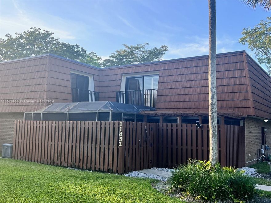 Stunning 3 Bedroom 2.5 bathroom home in the heart of Davie in the highly desired Lake Pine Village Community. This bright and spacious home is beautifully maintained and updated. Pride in ownership shines through this lovely home. Impact doors and windows throughout. Nicely updated kitchen, tankless water heater, tile and wood floors throughout. Amazing screened in patio for fun and entertainment, step into the balcony for some fresh air or step outside into this gorgeous community and enjoy the pool, barbeque area, indoor racquetball, or just relax by the lake. This community has so much to offer. Wonderful and appealing kitchen. Quiet neighborhood with great schools, nearby Sawgrass Mills Mall, the BBT Center, and access to I-595, I-75, and the Sawgrass Express Way