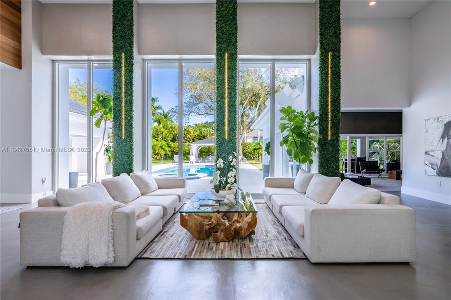 Welcome to your private oasis in beautiful Sunset Estates. This modern residence was gut-renovated in 2020, and since then meticulously maintained and constantly worked on by the current owner. Home wraps around brand-new pool deck area and sits on an acre lot, surrounded by lush landscaping for full privacy. The residence features a grand living room, a wet bar, an office, an incredible chef's kitchen equipped to the highest standards, and an upstairs loft that is currently being used as a gym and can be easily converted into another bedroom. Master suite is the star of the home - featuring a spa-like bathroom with oversized shower and lots of windows, and an expansive walk-in closet (converted sixth bedroom). Must see to appreciate this incredible residence.