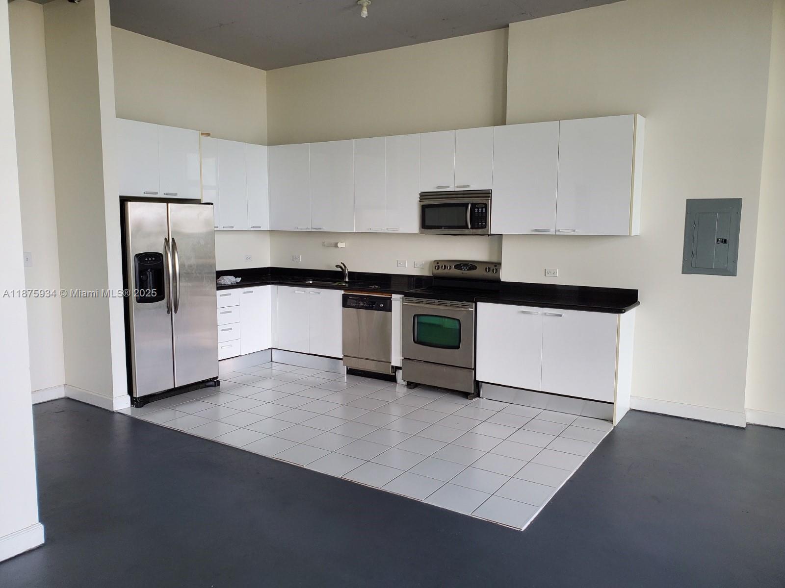 This unique loft residence features 12-foot ceilings and generous open, flexible design space. Contemporary
kitchen with granite countertops, stainless steel appliances, full-size washer/dryer unit, impact-resistant windows,
storage space, pre-wired for telephone/satellite/internet. The beautifully landscaped pool area, secure parking
garage. Adjacent to downtown Hollywood shopping, dining & entertainment.