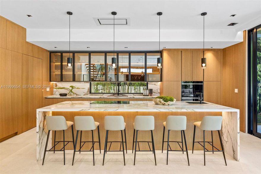 Striking modern design meets warm, livable luxury in this brand-new 2-story residence offering 3 bedrooms and 3.5 bathrooms. Clean architectural lines, soaring ceilings, and dramatic walls of glass create a light-filled, gallery-like space designed for both everyday living and elevated entertaining.

At the heart of the home, a showpiece kitchen features imported Italian porcelain slab countertops, a bold waterfall island, custom cabinetry, integrated wine storage, and a premium Sub-Zero appliance package.

Seamless indoor-outdoor living defines the experience as oversized sliding doors open to a private, resort-style backyard with pool, spa, expansive terrace, and lush tropical landscaping.

The upstairs primary suite is a true retreat, complete with floor-to-ceiling glass, a spa-inspired marble bathroom with freestanding soaking tub, floating vanities, and boutique-style custom closets.

Thoughtfully curated throughout with a floating staircase, custom millwork, designer lighting, and 10-foot hingeless doors.

A refined, design-forward home that stands apart from typical new construction. 

Stunning in photos - unforgettable in person! 

Call Jaclyn to set up a showing.