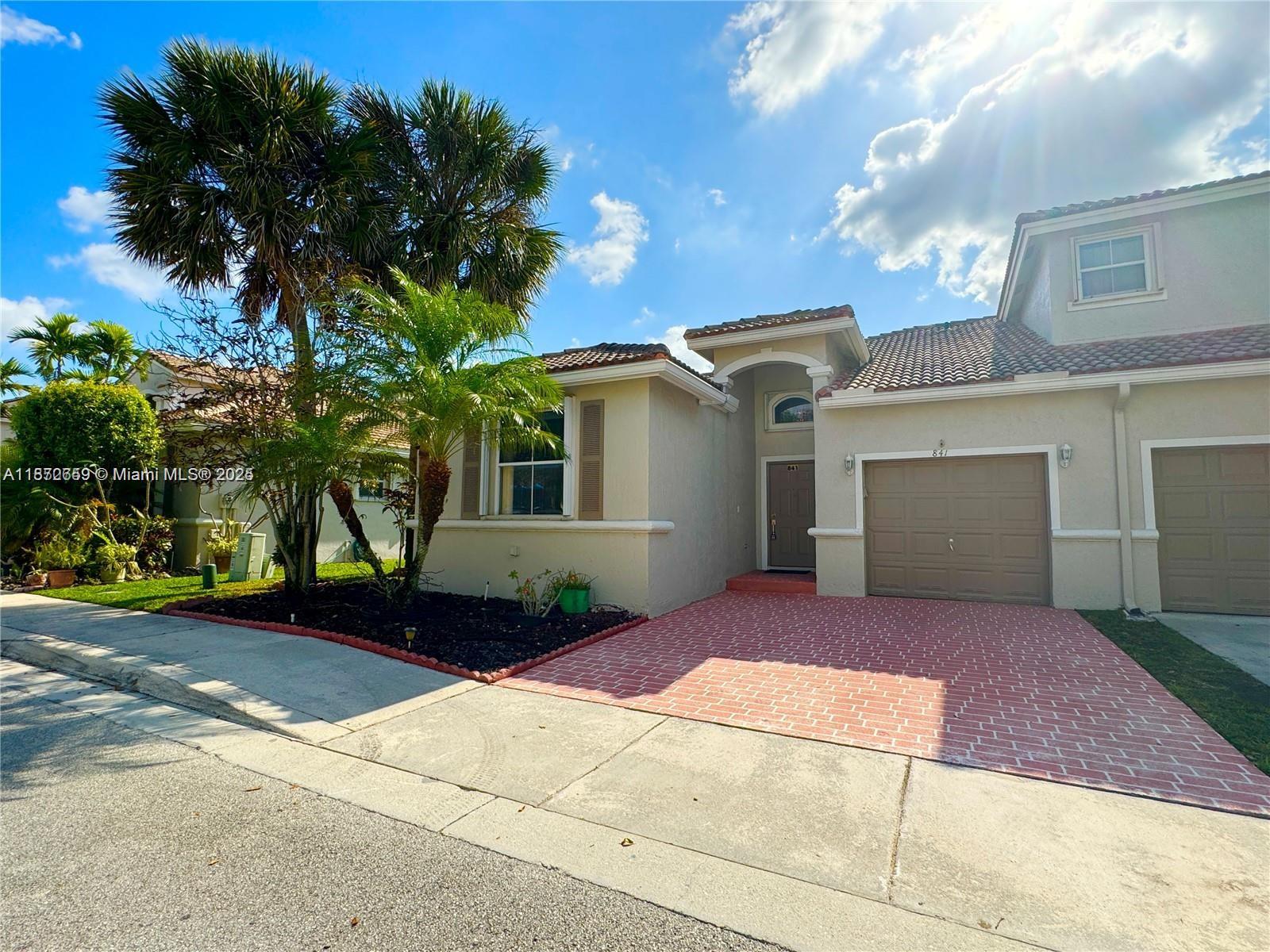 Beautiful one story townhome located in gated community. This 3-bed, 2-bath townhome features high ceilings and recent renovations all throughout. The kitchen has brand new stainless steel appliances, new sink, breakfast nook area and island with room for bar stools. The master bathroom has a renovated walk in shower and walk in closet. Ample backyard space to enjoy for families with kids and pets. Full washer and dryer located in the one car garage. 2 parking spaces in driveway. Located in the heart of Pembroke Pines you are minutes from A-rated schools, shopping and dining such as Pembroke Gardens and lakes malls and quick access to major highways. The unit comes partially furnished, with the owner open to custom arrangements. Don't miss out—schedule a viewing today!