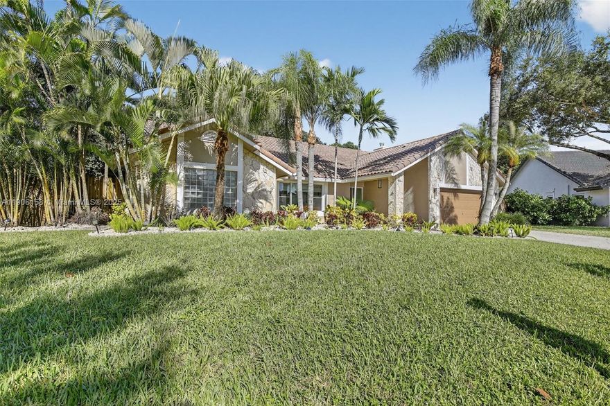 Great opportunity to live in this very special, updated, spacious 4-bedroom 2.5 bath custom-built home with pool on a Private fenced tropical parklike 1/2 acre cul-de-sac lot offered by the original owner. This home shows pride of ownership & is ready for a new family to enjoy as much as they did..From the moment you enter under the large covered entrance to this carpet-free home you will enjoy the soaring high ceilings & creative architectural designs, updated kitchen & laundry room, split bedroom plan, great closets, great family room with great natural lighting, electric marble fireplace, window seats, updated wet bar, formal dining room & grandious primary suite with walk in shower, jacuzzi tub & floating vanities. Enjoy indoor/outdoor living to its fullest, complete with impact glass.