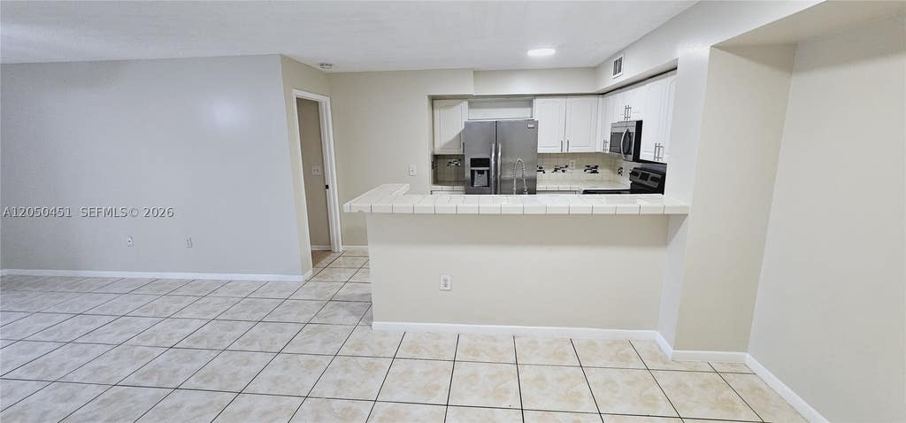 Photo of 1707 Village Blvd #208, West Palm Beach, FL 33409 (MLS # A12050451)